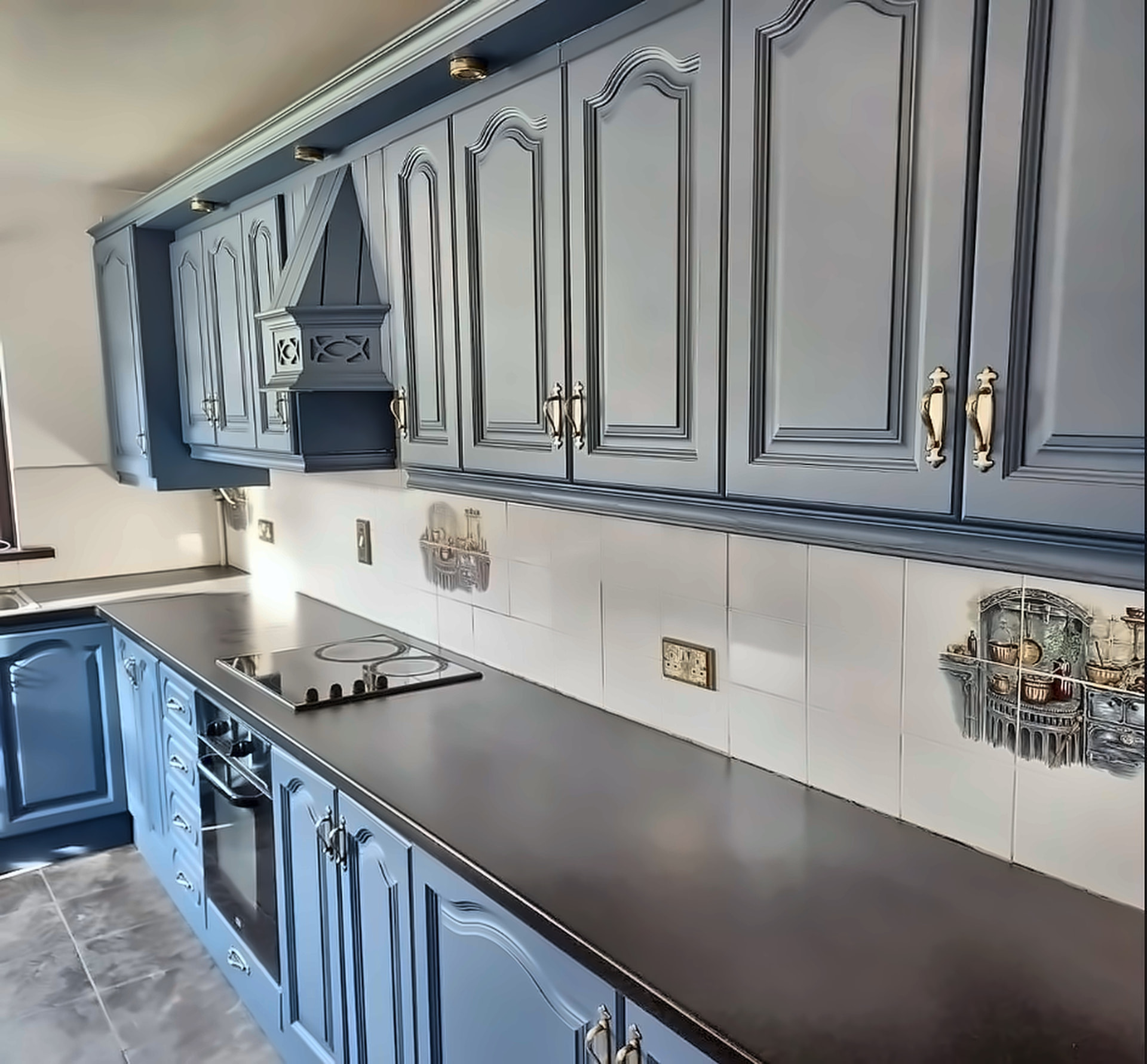 Classic kitchen cabinets resprayed in a soft blue grey with brass handles